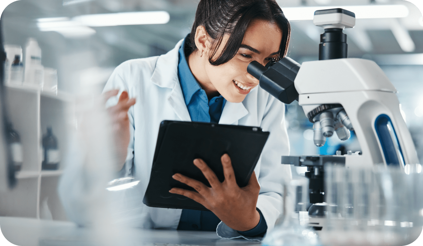 Doctor looking in microscope - Tobacco Risk Evaluation 50_50