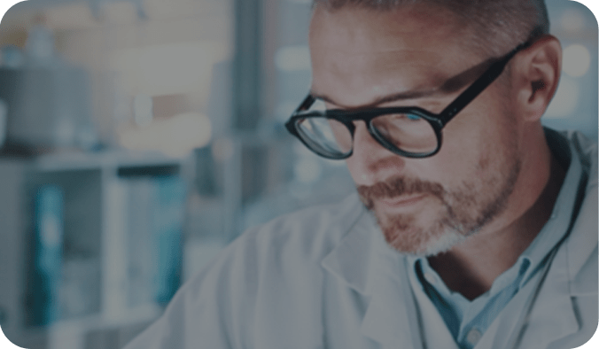 Doctor looking in microscope - Tobacco Risk Evaluation 50_50